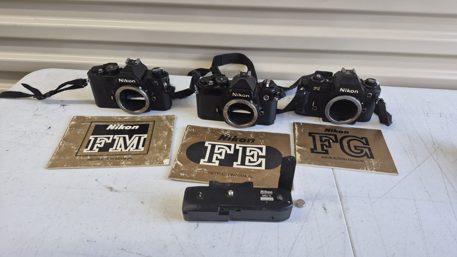 Lot Of 3 Nikon Cameras FE, FM FG with Instruction Manuals UNTESTED Parts Repair 