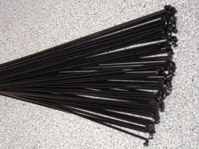 36 Custom length 12g (2.6mm) Black Stainless spokes with Silver Brass nipples 
