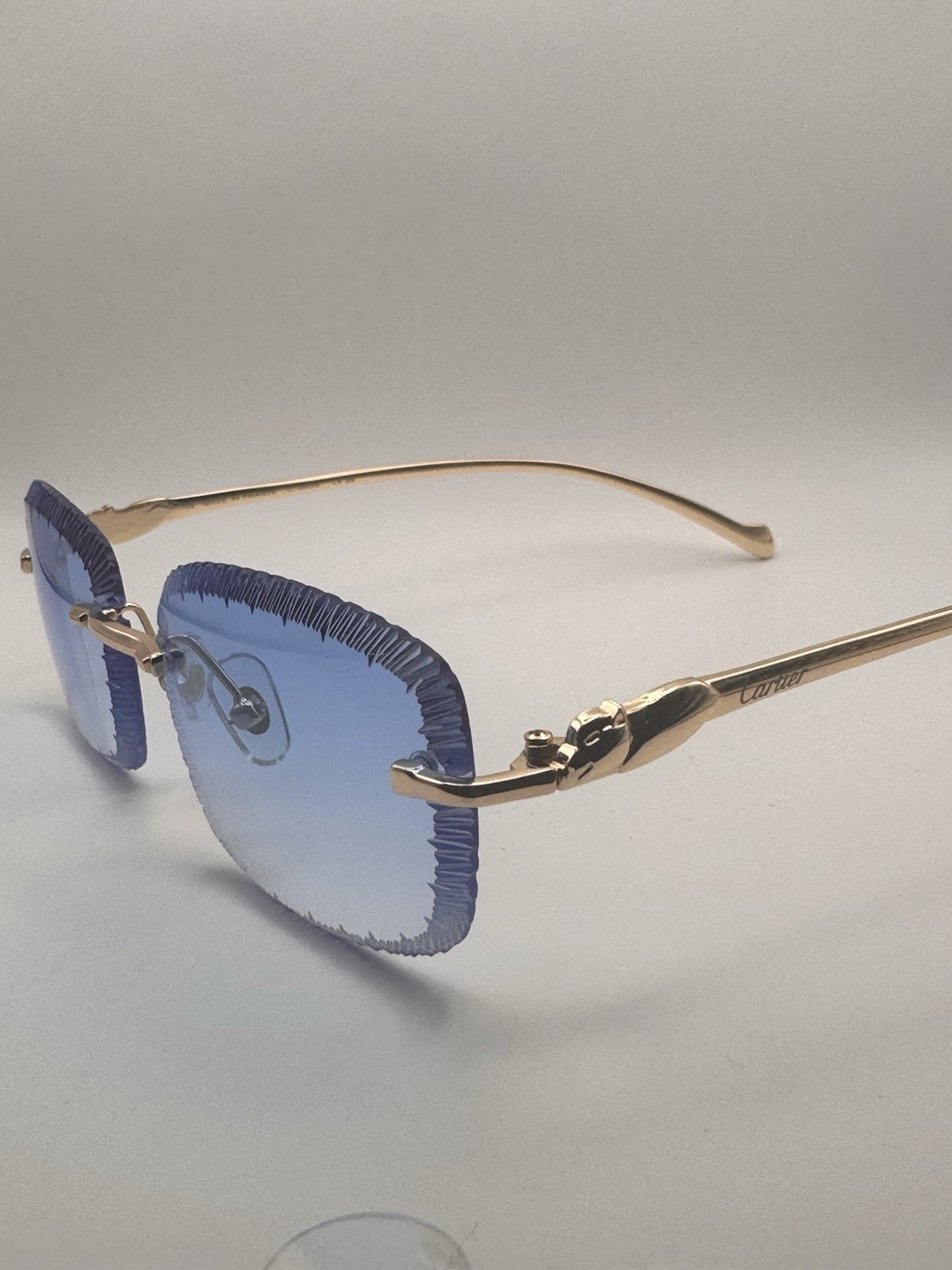 Cartier Panthère de Cartier Gold Temples Rimless Rectangular Sky Blue Lens Cartier Panthère de Cartier Gold Temples Rimless Rectangular Sky Blue Lens