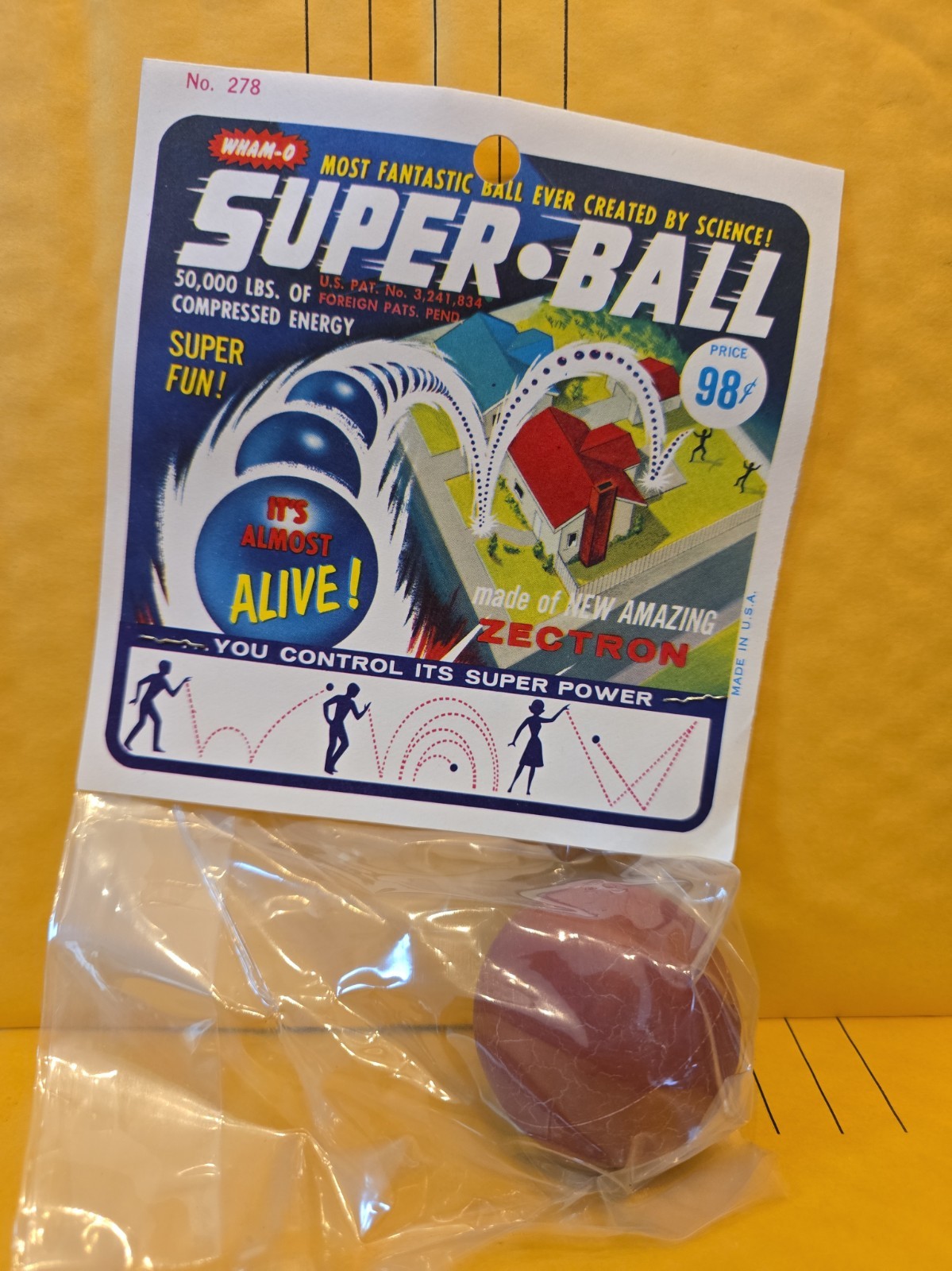 Vintage 1965 Wham-O Super Ball, No. 278, still sealed in original packaging. Red