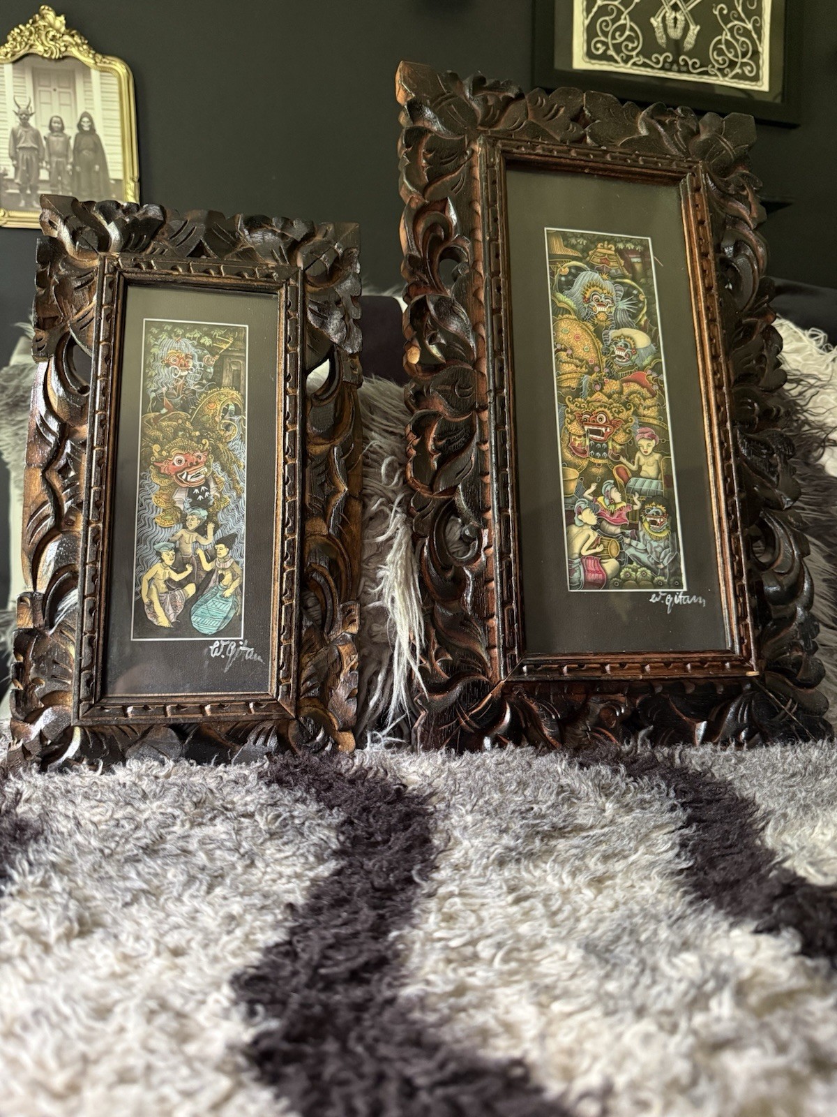2 traditional Balinese paintings. beautifully detailed, hand-carved wooden frame