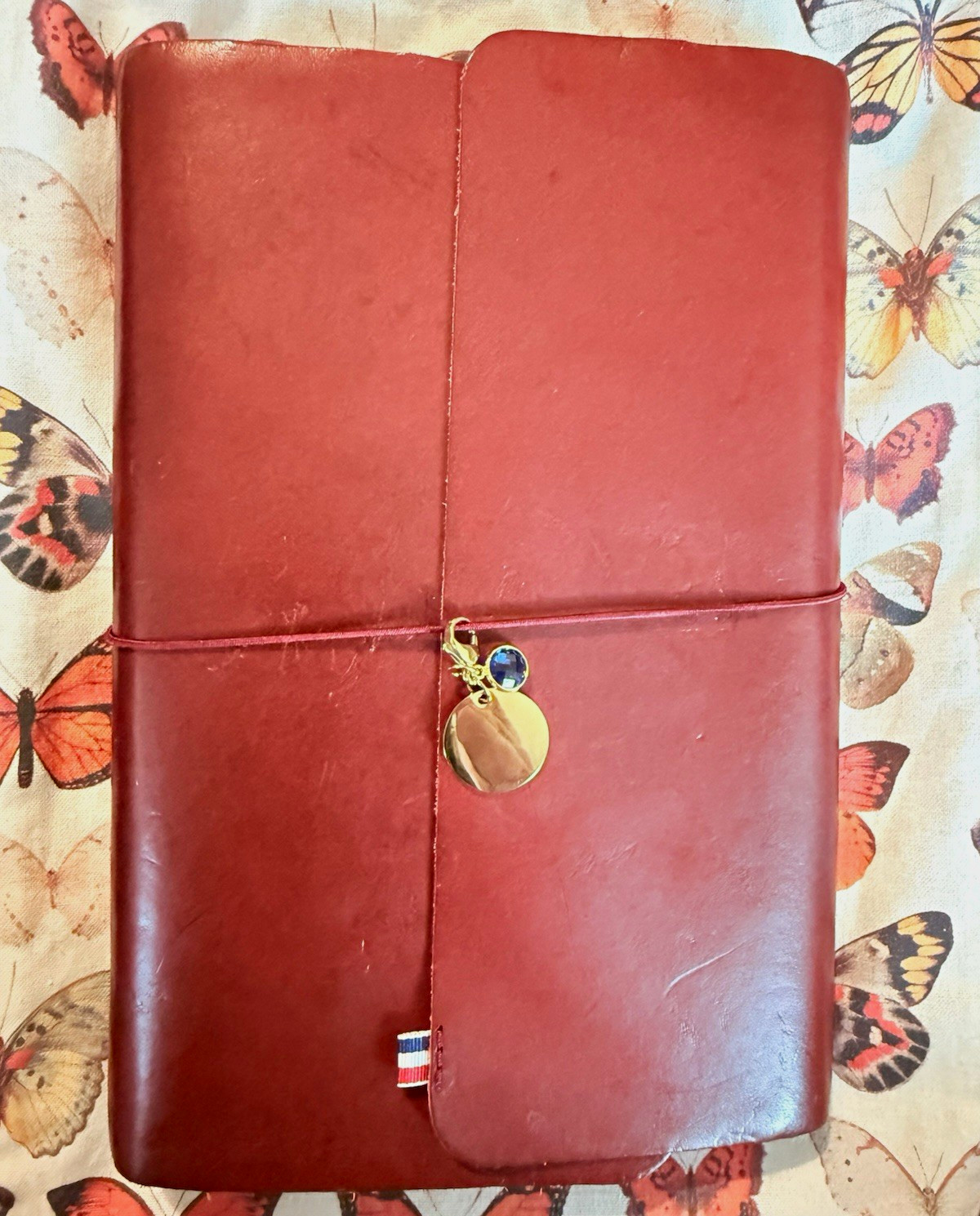 Louise Carmen honore in plum / prune / initials OMC