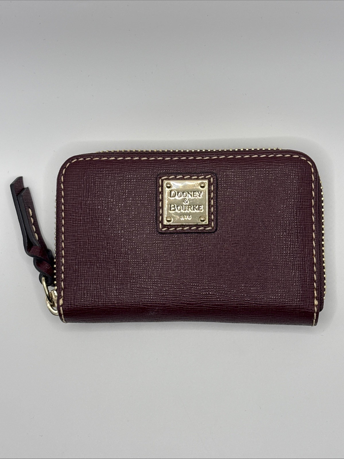 Dooney & Bourke Pebble Brass Zip Around Wallet Clutch Bordeaux Color