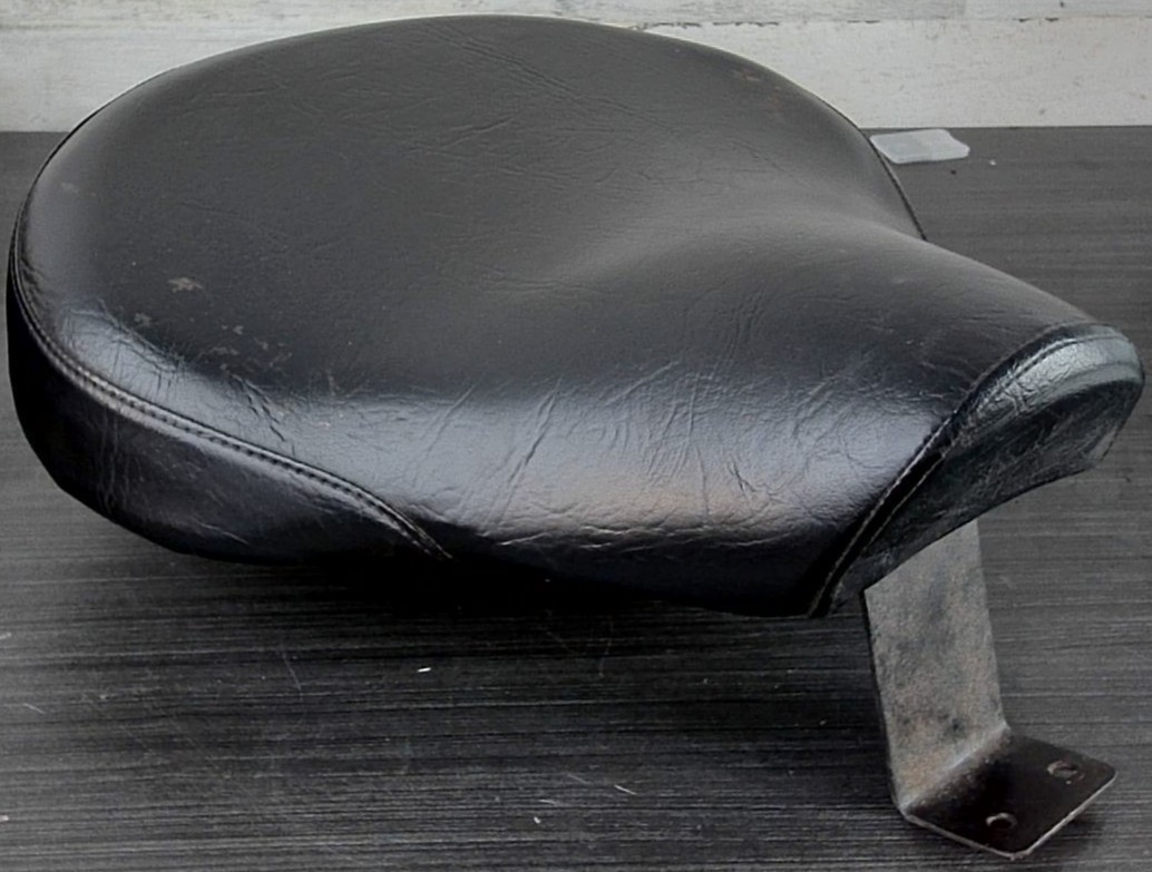 Antique BMW /2 solo tractor seat rear. Shelved near vent.