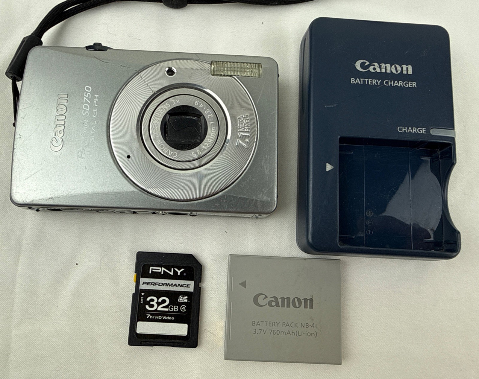 Cannon PowerShot Digital Camera SD750 7.1 Silver Digital ELPH Bundle 32GB TESTED Cannon PowerShot Digital Camera SD750 7.1 Silver Digital ELPH Bundle 32GB TESTED