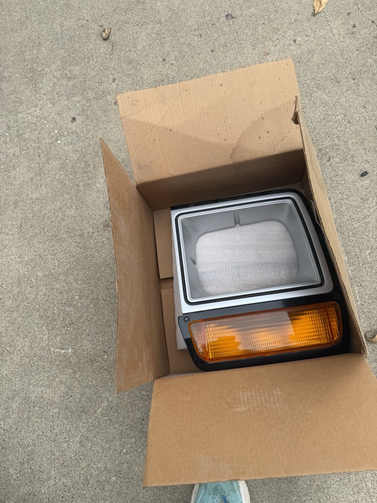 NOS Mopar OEM Headlight Bezel & Turn Sig Assembly 4249811. (1986-90Dodge Truck)