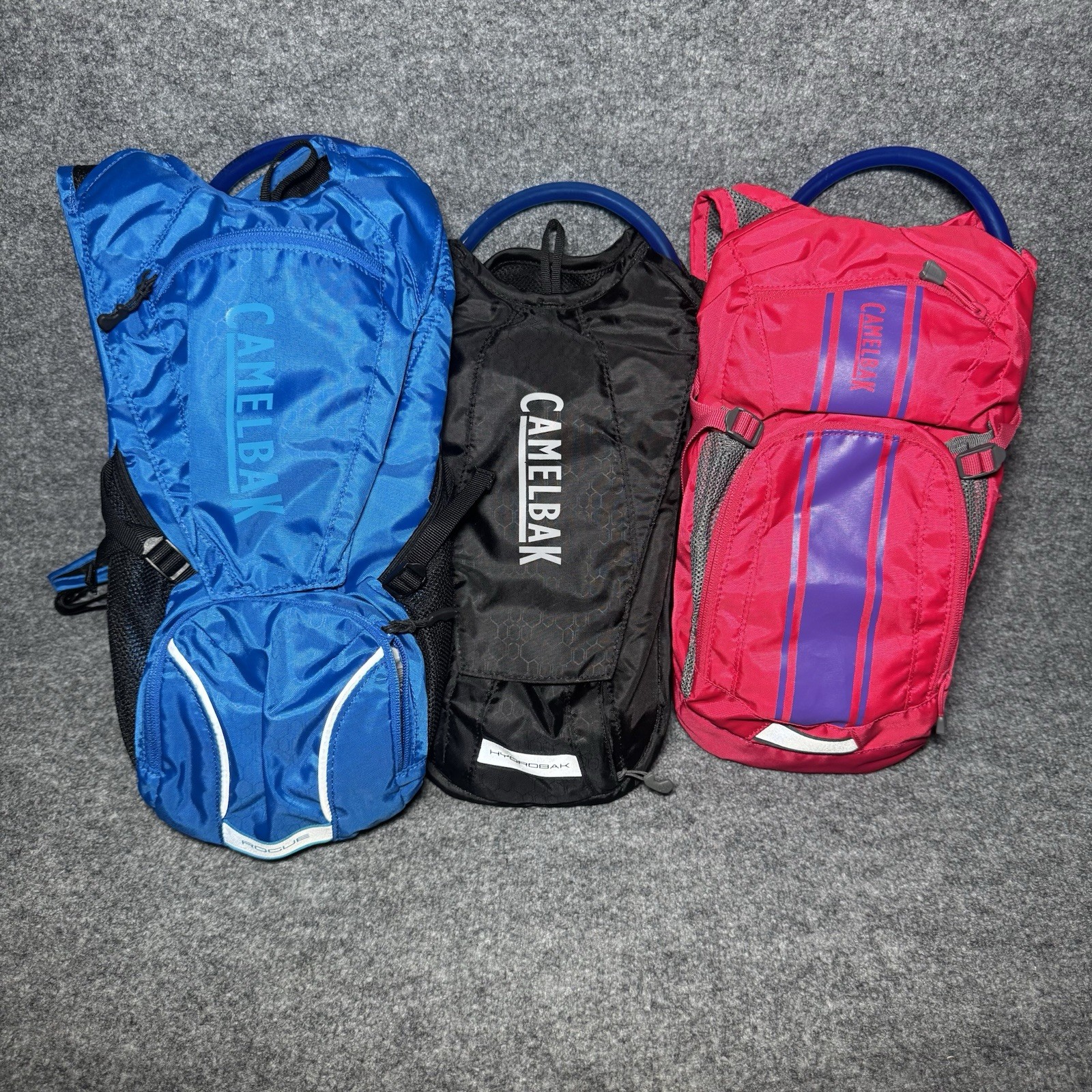 Lot Of 3 Camelbaks, Blue Rogue 2.5L, Black Hydrobak & Pink Camelbak 1.5L Lot Of 3 Camelbaks, Blue Rogue 2.5L, Black Hydrobak & Pink Camelbak 1.5L
