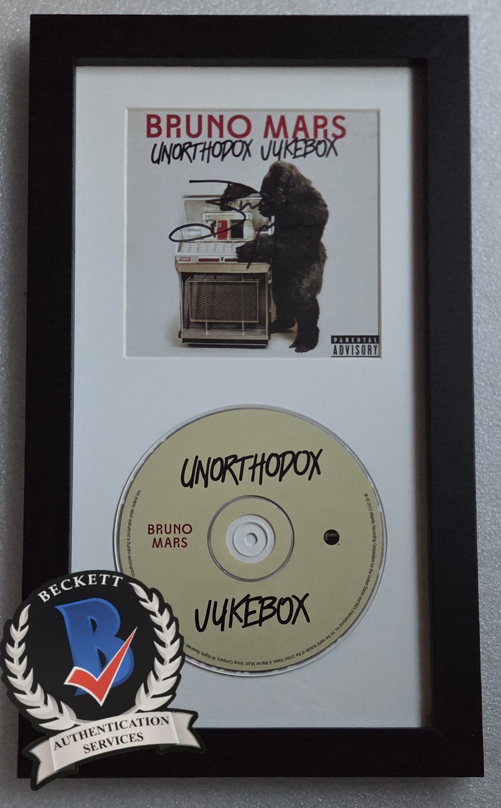 BRUNO MARS CD DISPLAY AUTOGRAPHED BECKETT BAS COA SIGNED RARE MUSIC PRESENT GIFT