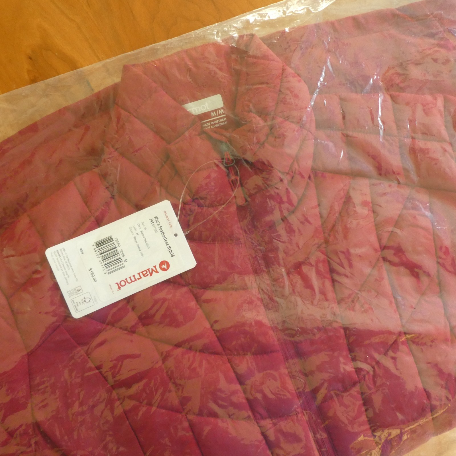 Marmot featherless hybrid Jacket, womens size medium, color sienna red.
