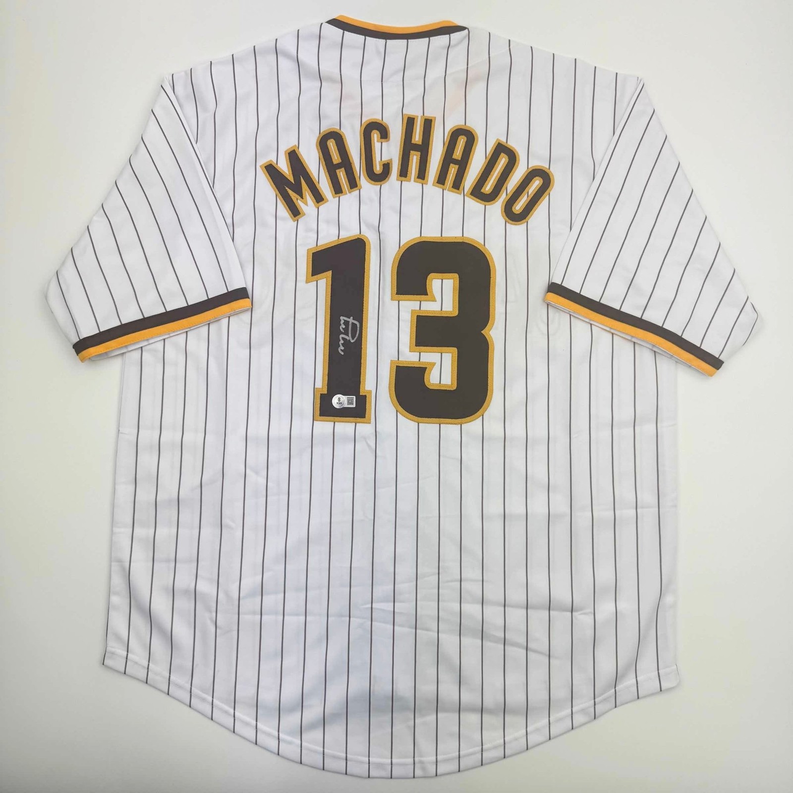 Autographed/Signed MANNY MACHADO San Diego Pinstripe Jersey Beckett COA Autographed/Signed MANNY MACHADO San Diego Pinstripe Jersey Beckett COA