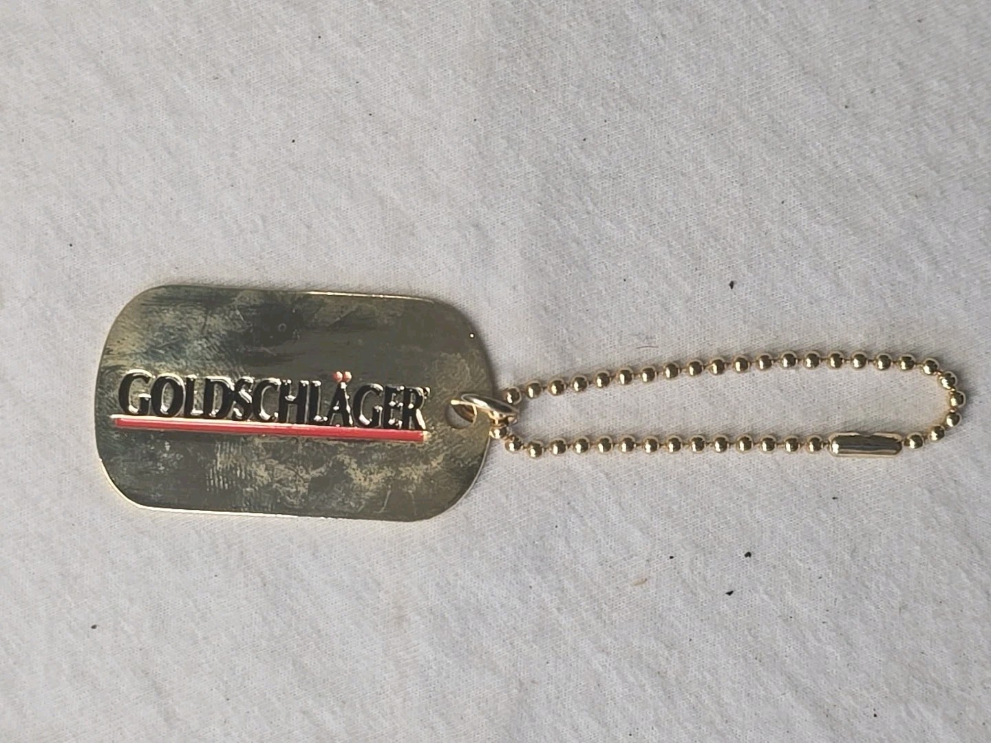Vintage Goldschlager Keychain Stamped Metal Enamel Liquor Promo Barware NOS