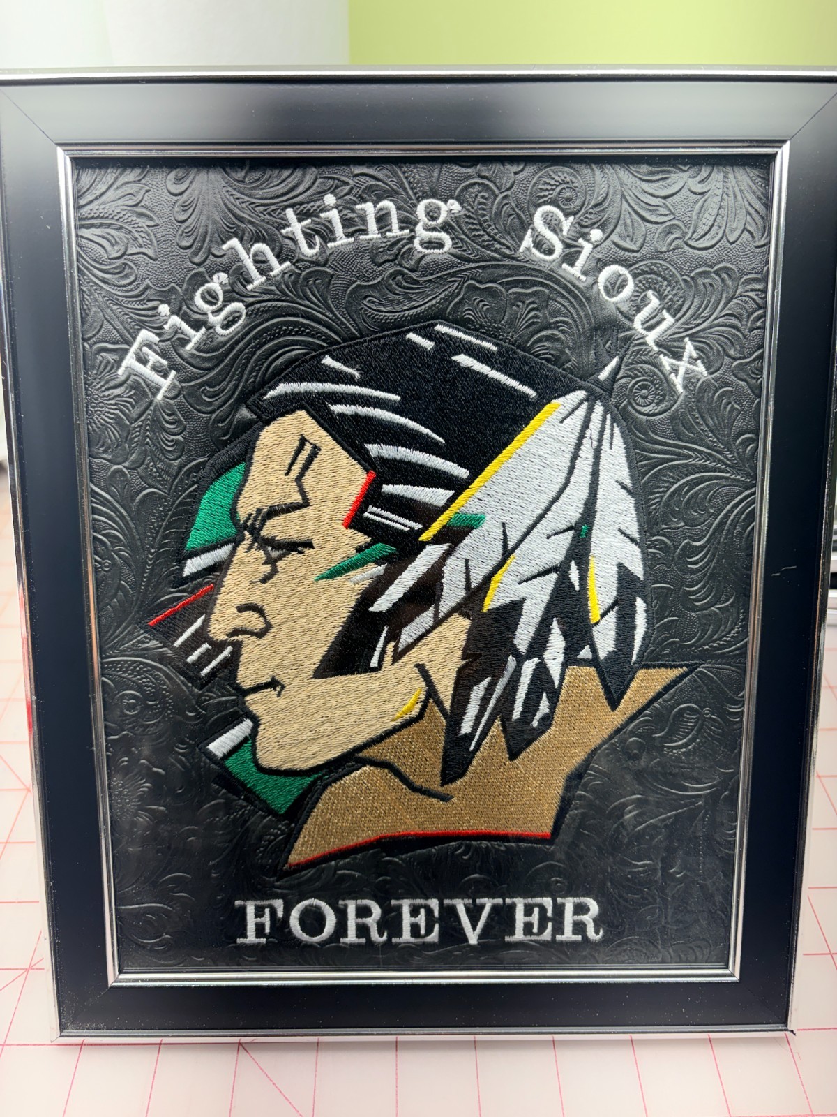 Fighting Sioux Embrodered Logo Framed and ready to display 8” X 10”