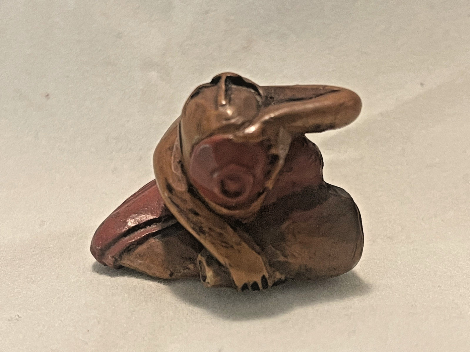 Netsuke Man Drinking Sake Wood and Red Lacquer Meiji Period