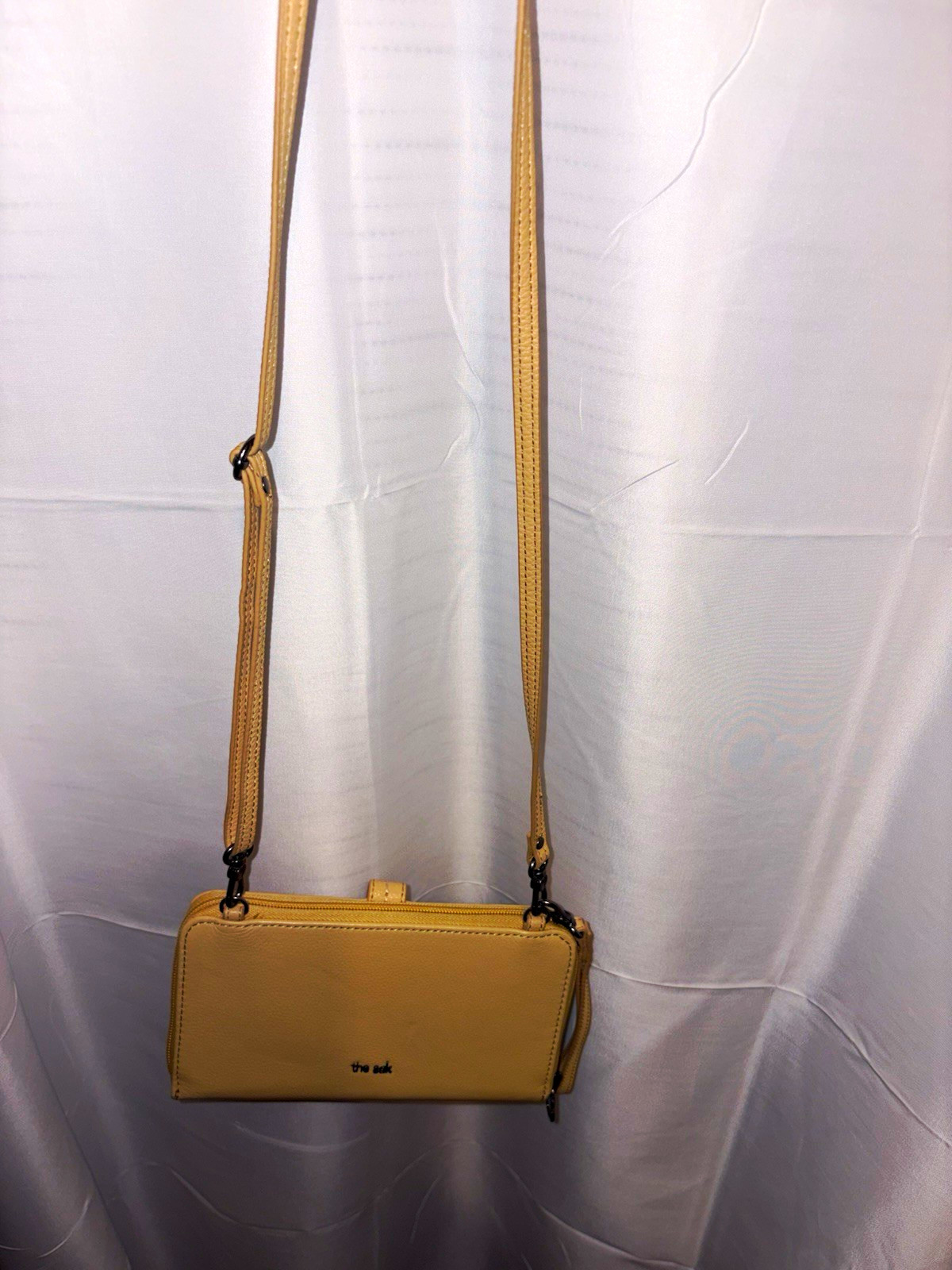 The Sak Small Pebbled Beige Zip Crossbody w/ Inner Pockets, Wristlet Strap The Sak Small Pebbled Beige Zip Crossbody w/ Inner Pockets, Wristlet Strap