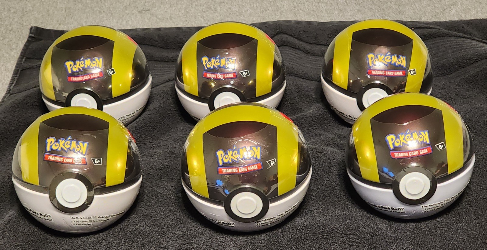 Factory Sealed Pokémon TCG Poke Ball Tin Gold Color, (3 Packs), Lot of 6