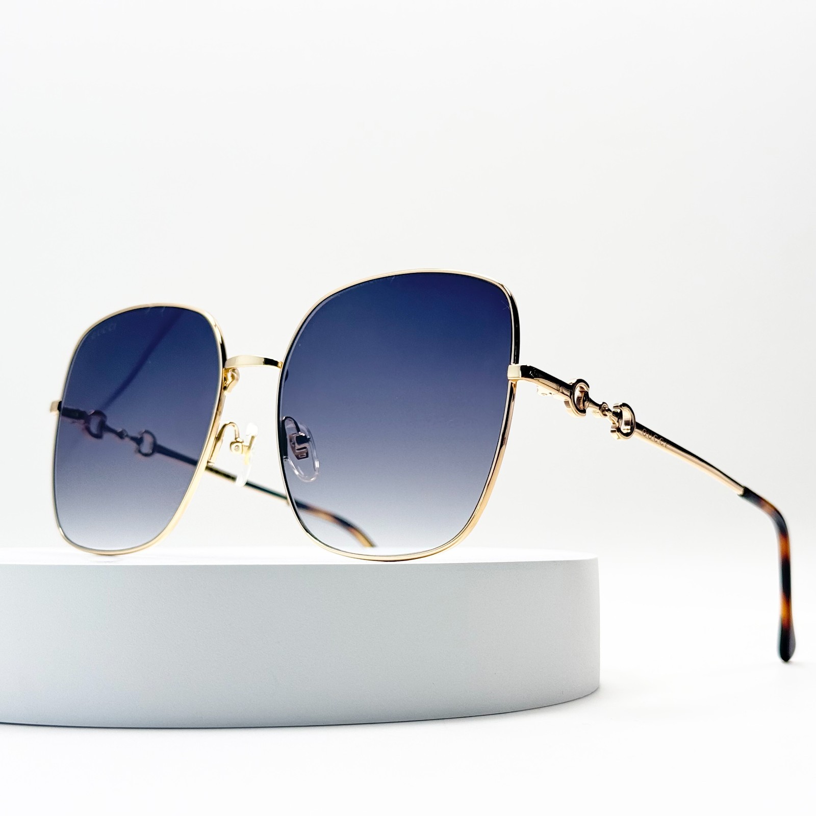 Gucci GG0879S Oversized Square Sunglasses Gold Frame Blue Gradient Lens