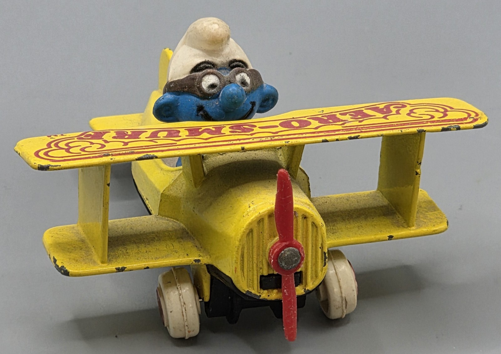 Vintage 1982 ERTL Aero Smurf Yellow Diecast Airplane Peyo Smurfs Toy Propeller