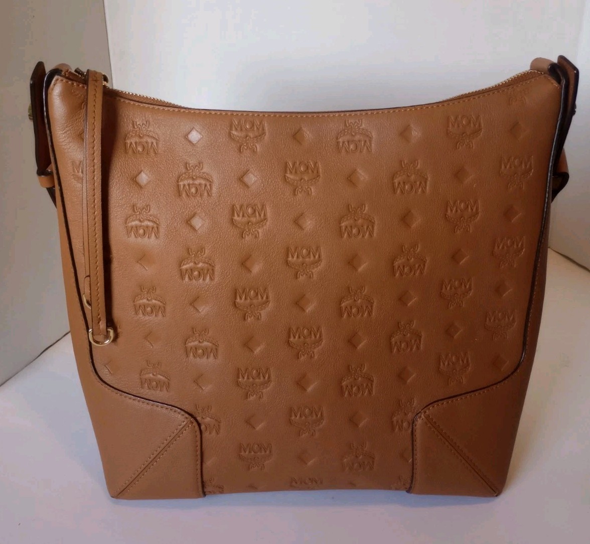 Authentic MCM Medium Klara Pecan Monogram Embossed Leather Hobo Bag W/ Dust Bag Authentic MCM Medium Klara Pecan Monogram Embossed Leather Hobo Bag W/ Dust Bag
