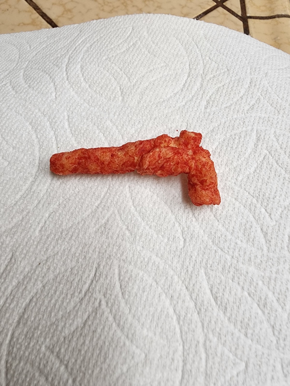 hot cheeto shape like a 44 Magnum handgun