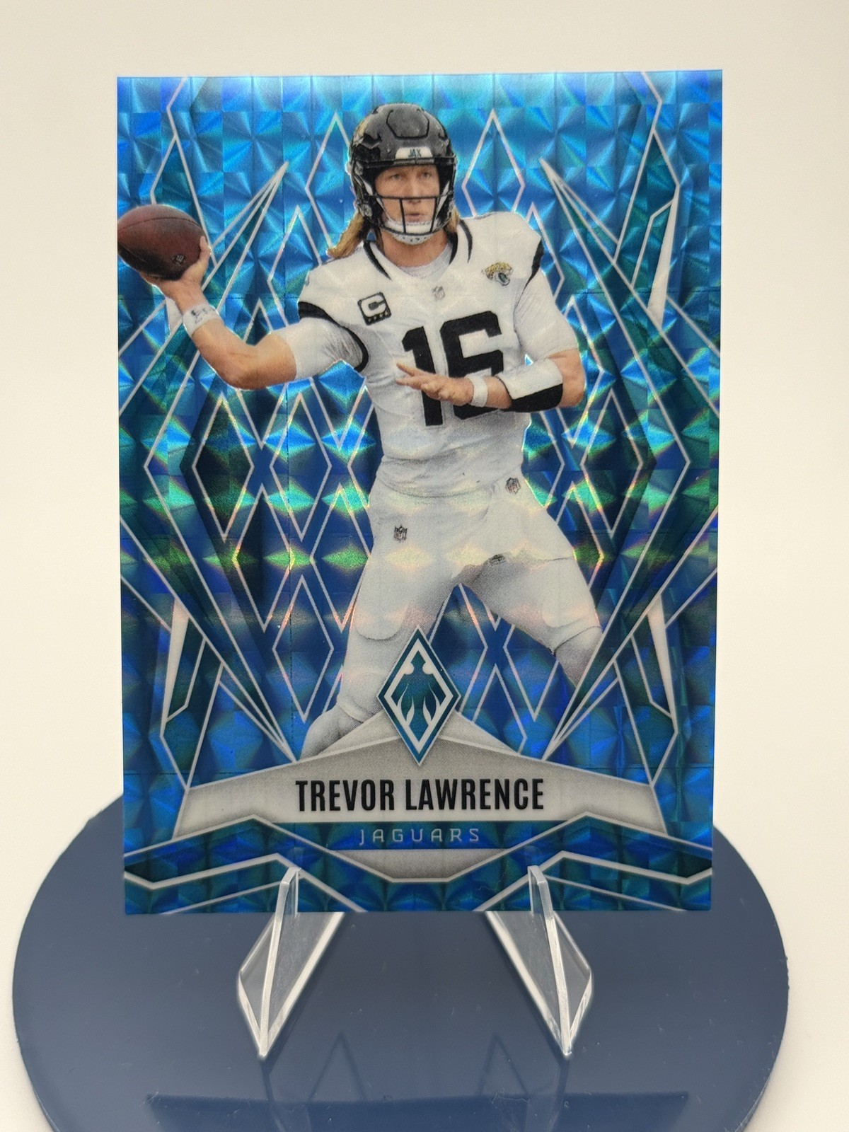 2025 Panini Phoenix - Trevor Lawrence #15 Light Blue Pyramids /385 2025 Panini Phoenix - Trevor Lawrence #15 Light Blue Pyramids /385