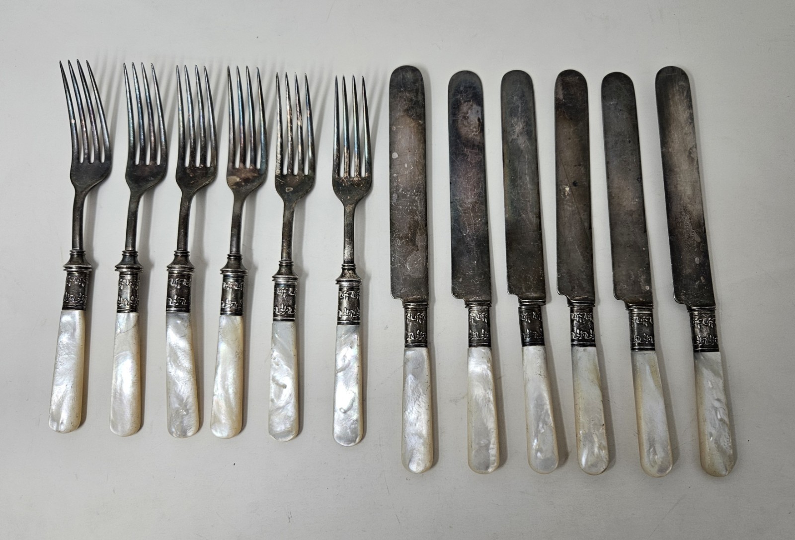 MOTHER OF PEARL HANDLE STERLING BAND SET OF 12 LANDERS FRARY & CLARK 
