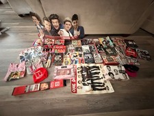 One Direction Merch: Deluxe CDs, t-shirts, hats, posters, magazine, perfume picture