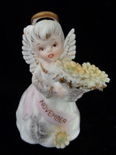 Vtg Lefton 3332 November Birthday Angel Figurine with Yellow Mums - a picture