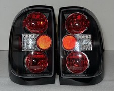 96-04 Nissan Pathfinder / 97-04Infiniti QX4 Black Housing Tail Lights picture
