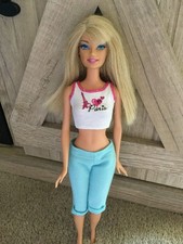 2009 Mattel Barbie Paris Fashions #T4896 Barbie Doll White Top Light Blue Pants picture