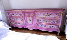 Magnificent Pink and Gold Dresser With Floral Details picture
