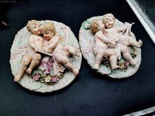 VINTAGE BISQUE PORCELAIN WALL PLAQUE WITH CROSSED ARROWS MARK SET OF TWO picture
