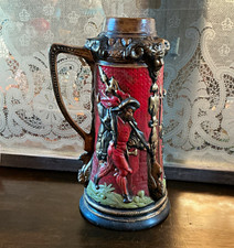 Vintage German ceramic beer stein featuring Renaissance lansquenet figures picture