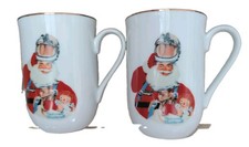 Set of 2 - Vtg 1983 Norman Rockwell Space Age Santa 24k Gold Rimmed Coffee Mugs picture