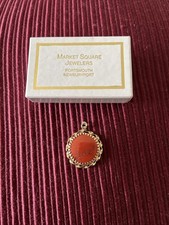 vintage 14k gold pendant featuring a round, rich red vintage coral or red jasper picture