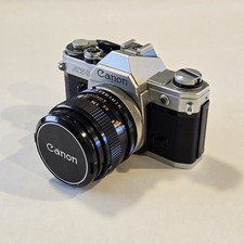 Vintage Canon AT-1 35mm SLR Film Camera w/ Canon FD 50mm f/1.4. Lens picture