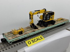 MTH O scale 3 rail with a CATERPILLAR M323F HIGH RAIL EXCAVATOR on UP 915731 MOW picture