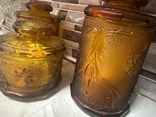 Vintage Amber Glass Floral Embossed Canister Set (3) w/ Lids, picture