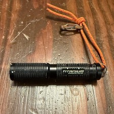 Titanium Innovations Illuminati Black Flashlight AAA Battery Powered picture