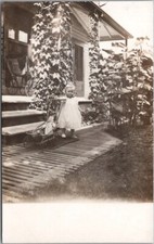 c1910s RPPC Real Photo Postcard Baby Girl with DOLL in Stroller / House Porch picture