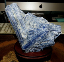GORGEOUS HUGE SPECIMEN OF BLUE KYANITE IN A WOOD STAND picture