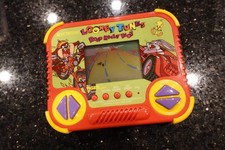 Vintage Tiger  Looney Tunes RIOT Handheld Electronic Tabletop Video game  D6 picture
