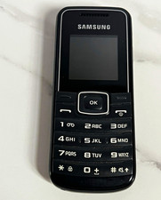 Vintage Samsung Bar Cell Phone Model GT-E1050 and Travel Charger From 2011 picture