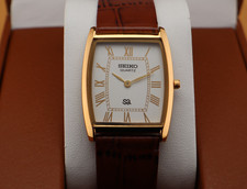 Vintage Seiko Slim Quartz Men's Wrist Watch white Dial with Light Brown strap. picture