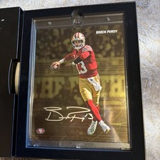 Brock Purdy Autographed Fanatics Emanate Gold 16/50 picture
