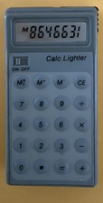 NEW Vintage 1980’s Gray Calculator Electronic Lighter. READ DESCRIPTION picture