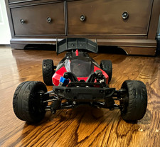 Arrma typhon grom 3s with battery/charger it runs well has aluminum a arms picture