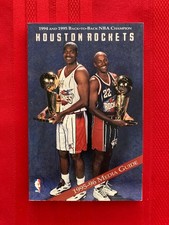 1995-1996 Houston Rockets media guide / 1995 NBA champions / Drexler / Olajuwon picture
