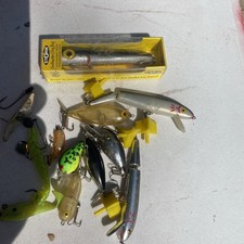 12 Fishing Lures various sizes see all pictures some excellent some not.From box picture