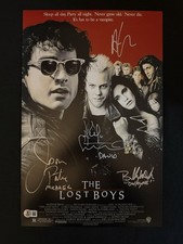The Lost Boys cast signed (Names in Disc) 11x17 photo W/Beckett witnessed COA picture
