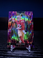 Panini 2025 Select Brock Purdy Premier Level Purple Shock Prizm #117 /699 picture